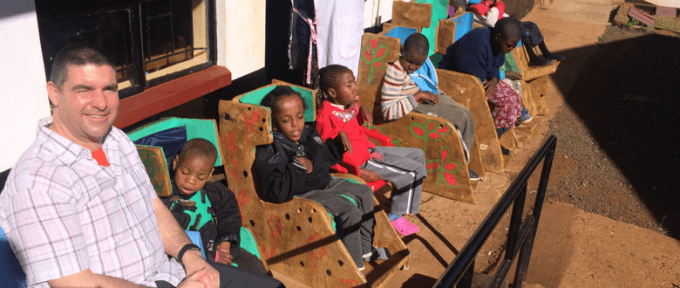 children on chairs in kenya
