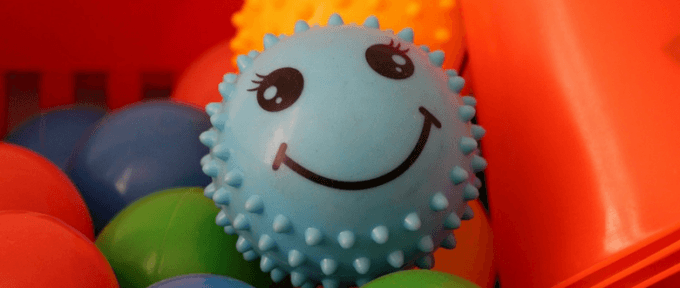 blue smiley face sensory ball toy