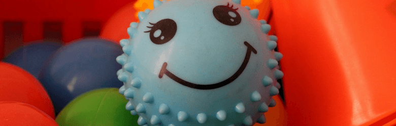 blue smiley face sensory ball toy