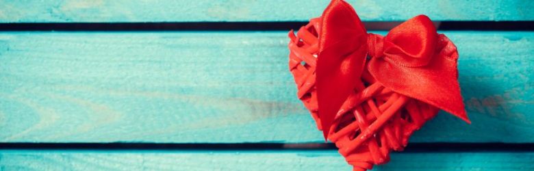 love heart on top of wooden background