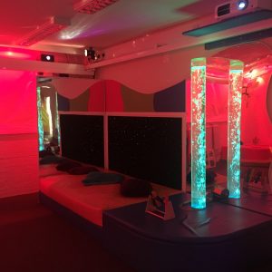 multi-sensory room at redbank house with waterbed and bubble tubes