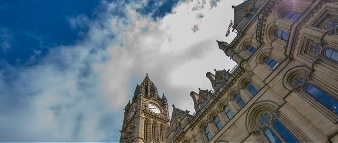 manchester town hall with cloudy sky