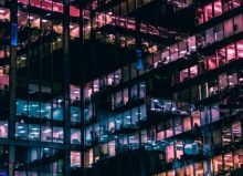 colourful windows of high rise office at night