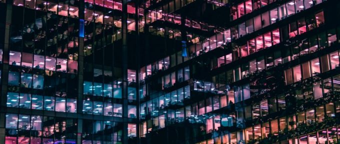 colourful windows of high rise office at night