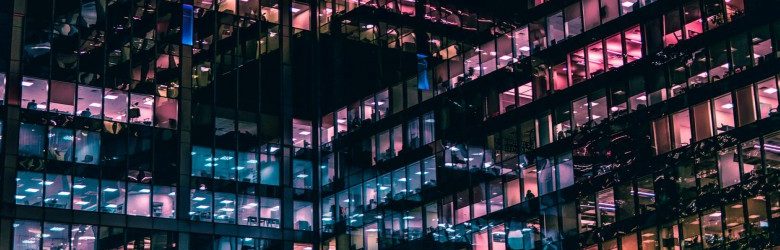 colourful windows of high rise office at night