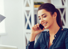 woman relaxed on the telephone in office