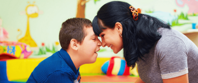 mother and son with cerebral palsy smiling
