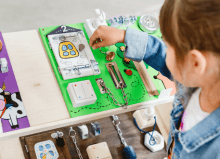 young girl playing with sensory toys