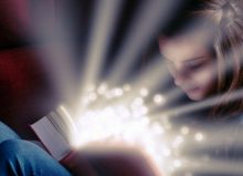 young girl reading a book looking magical