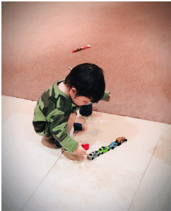 franklin playing with his toy cars