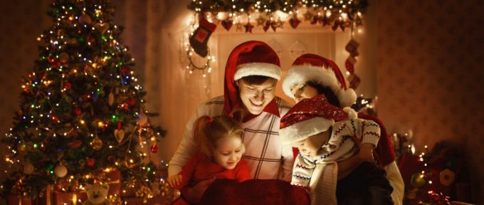 family opening christmas gifts