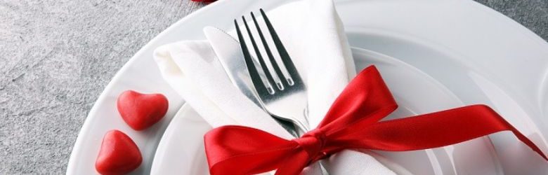 valentines meal table setting with ribbon on fork