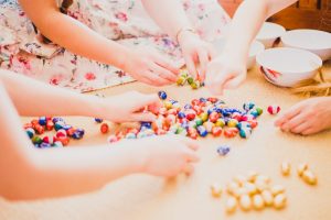 group of children sharing out easter eggs