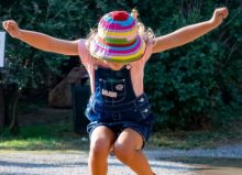 little girl jumping in the air