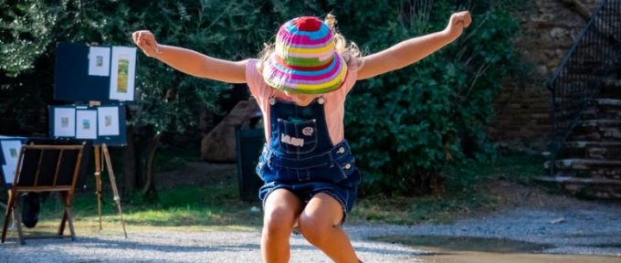 little girl jumping in the air