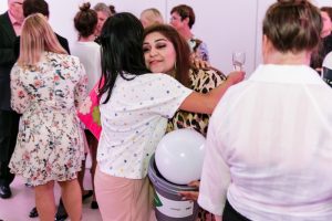 girl being hugged in the crowd